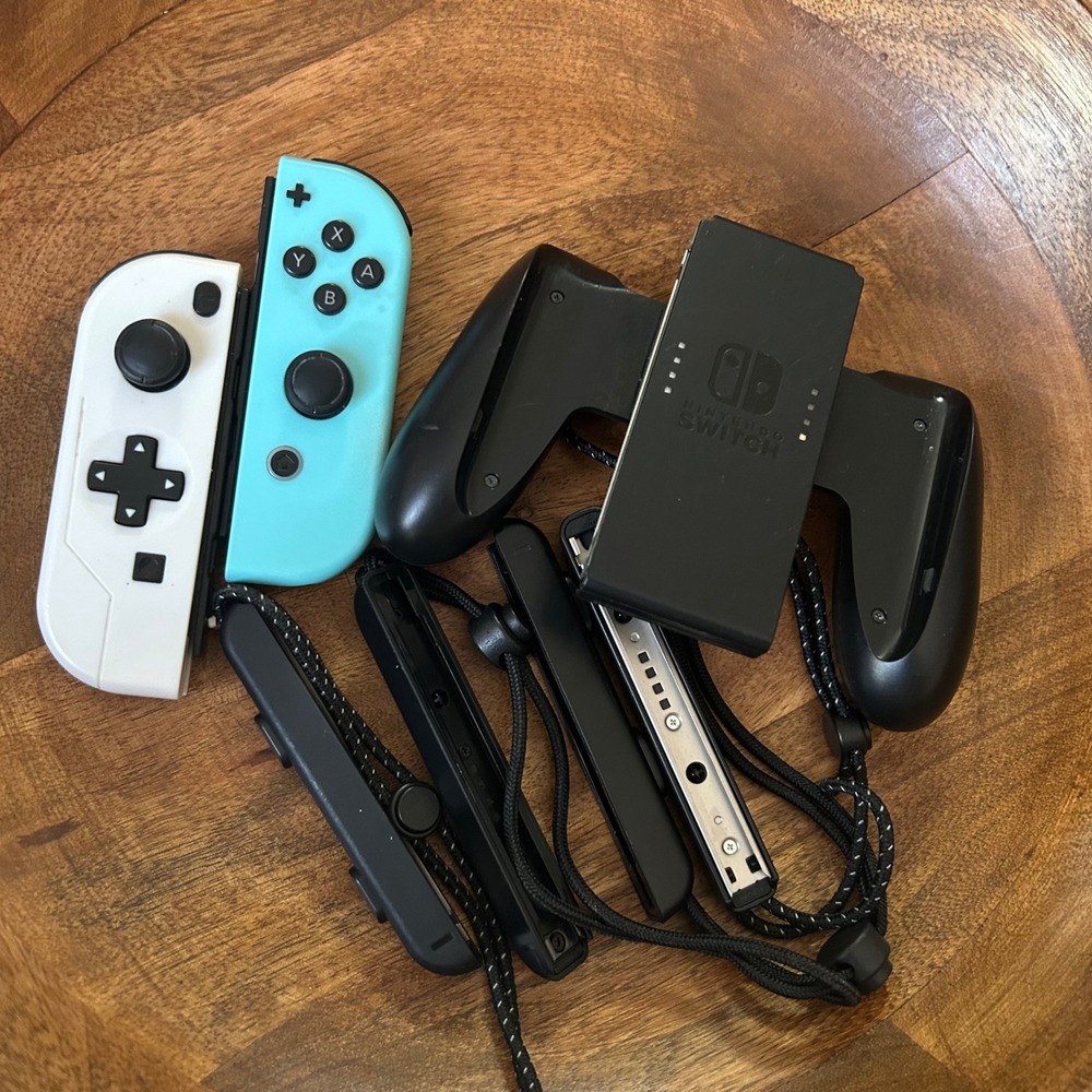 Nintendo Switch Joy-Con Controllers White Blue Charging Grip and Straps Bundle
